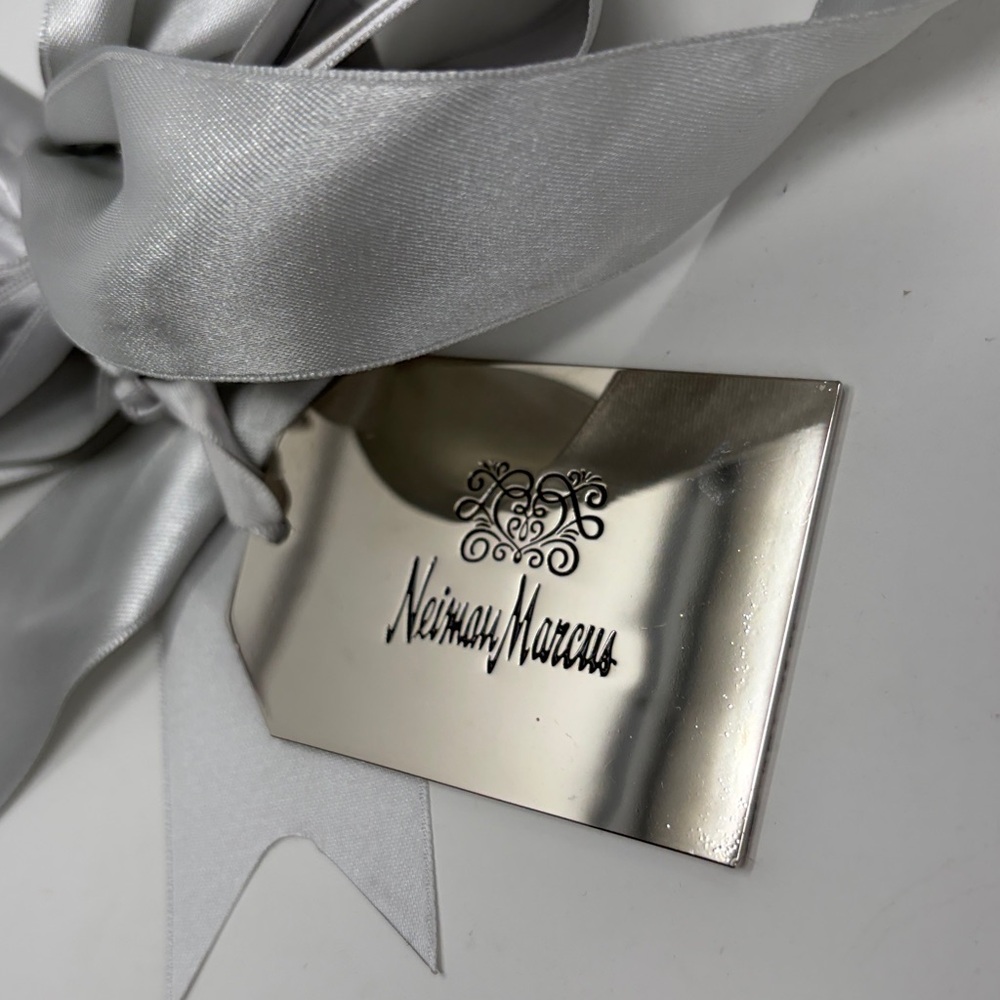 The Heart of Giving, Neiman Marcus silver gift tag with silver/gray ribbon